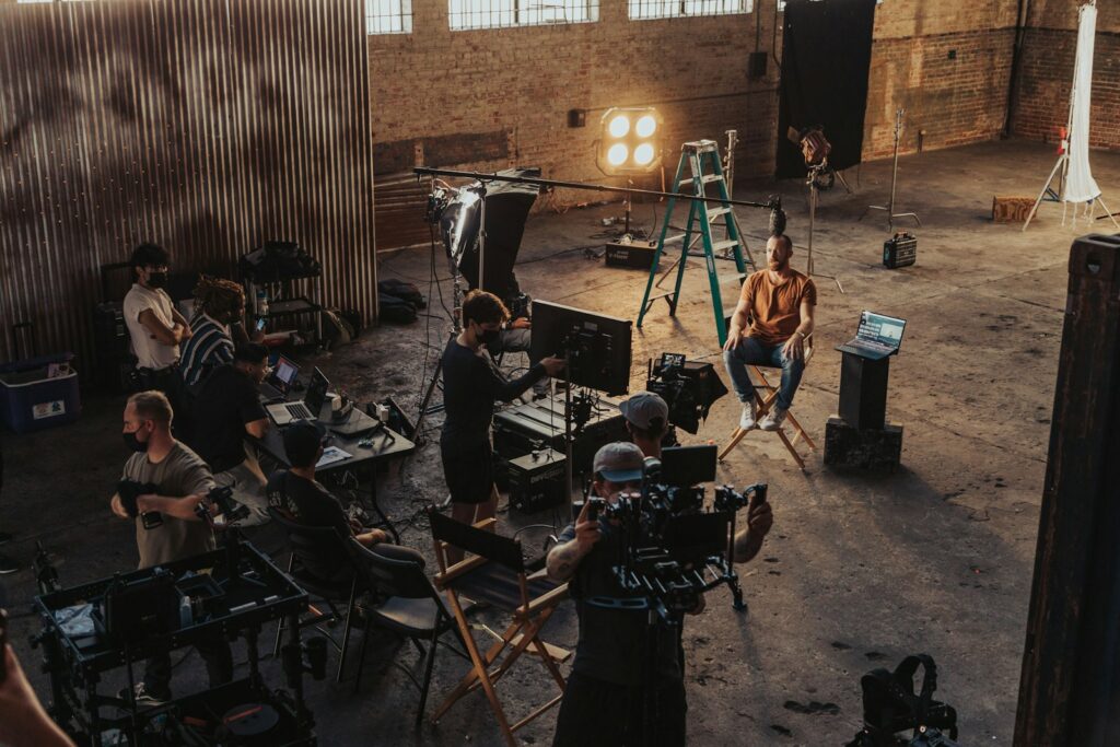 Content team on a video shoot with a camera set up, for a guide to content marketing services in Dubai