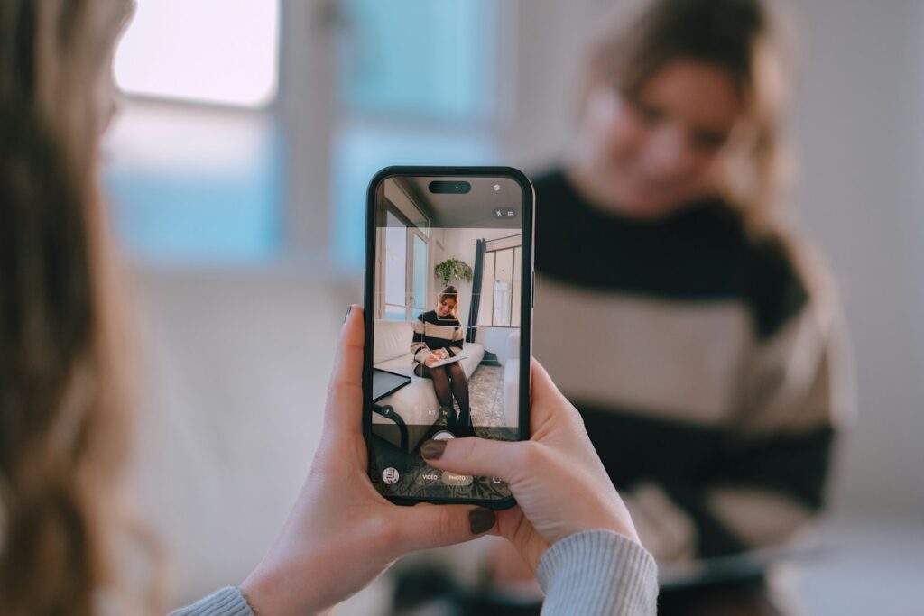 Creator taking a photo with a smartphone