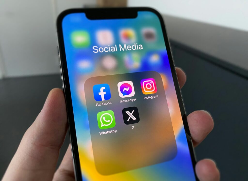 iPhone screen with social media app icons, for a guide to Instagram advertising in Dubai
